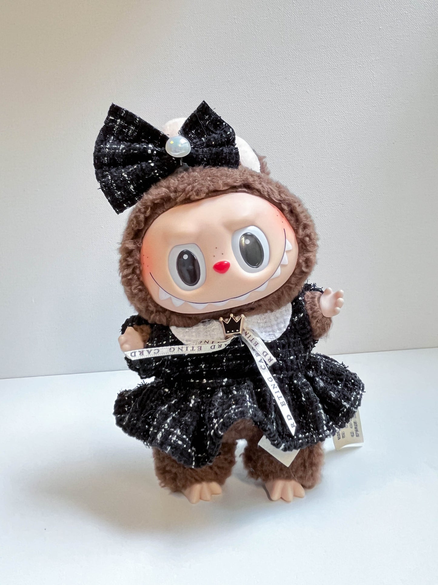 Black Textured Doll Dress with Bow Headband and Decorative Ribbon